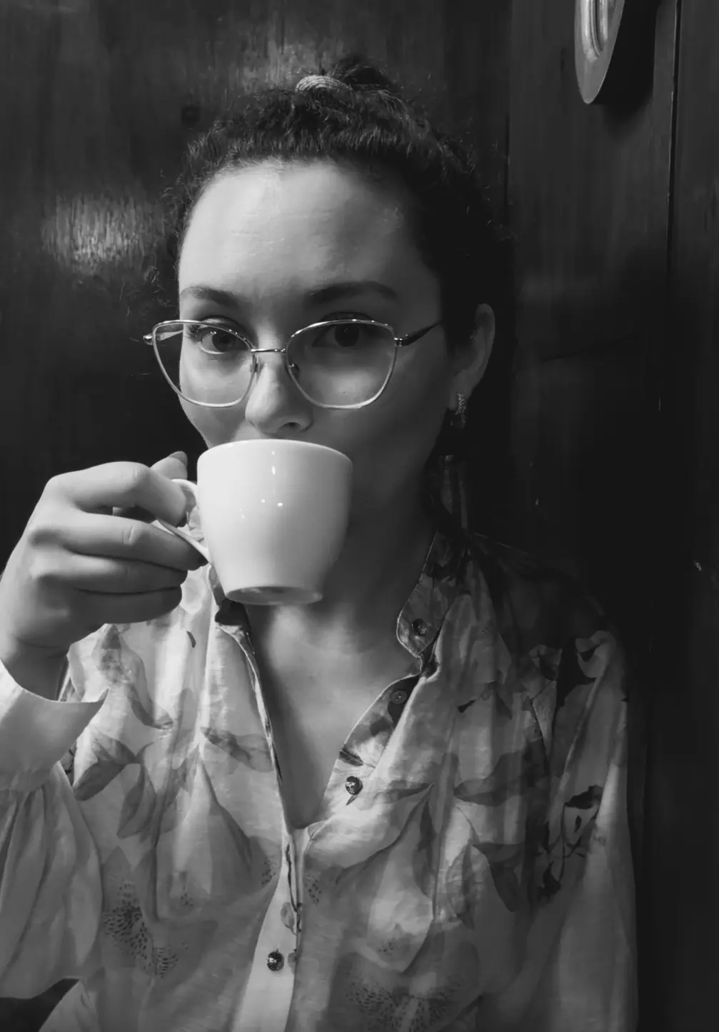 Photo of Sarah with a coffee